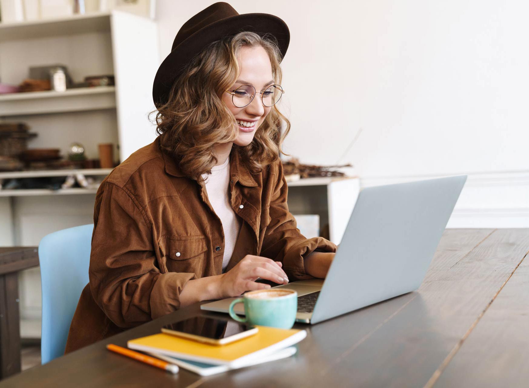 image-of-cheerful-woman-working-with-laptop-while-CNX4RJP