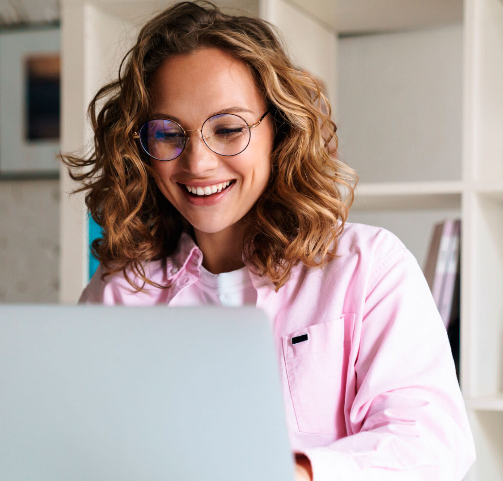 photo-of-joyful-woman-wearing-eyeglasses-smiling-a-8EUXMDJ